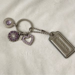 Coach silver leather and purple crystal charm